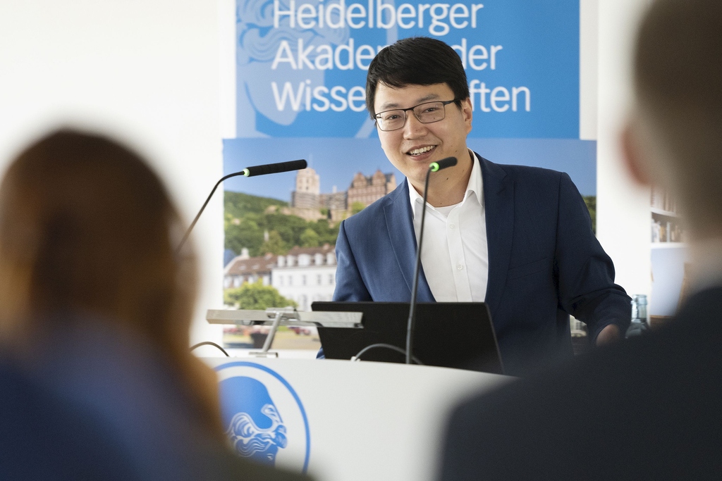 Picture of Dr. Huang speaking